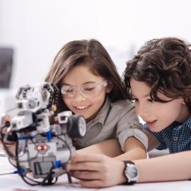 children interacting with creative STEM projects